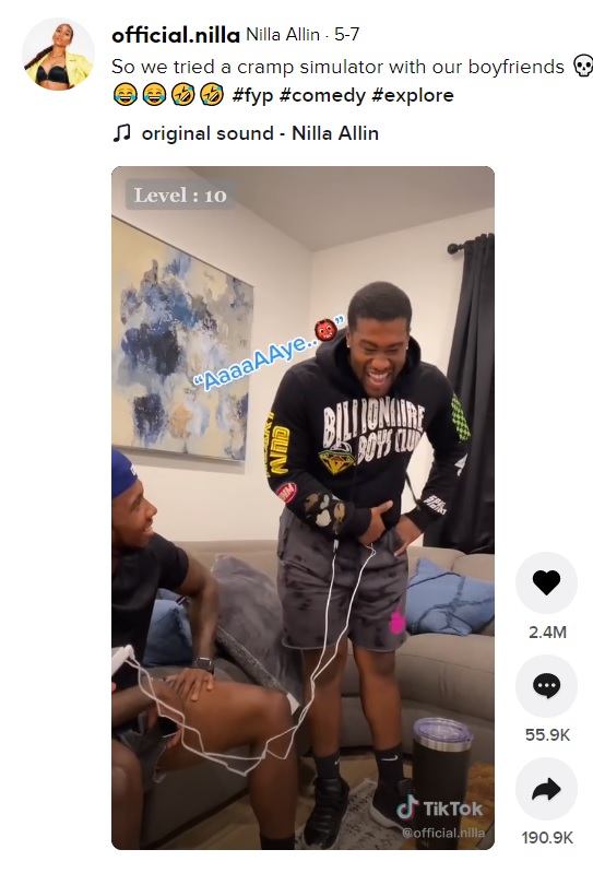 あまりの痛みに顔をしかめる男性（画像は『Nilla Allin　2021年5月7日付TikTok「So we tried a cramp simulator with our boyfriends」』のスクリーンショット）