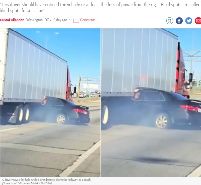 ホンダ車から手を振るレリーシャさん（画像は『The Independent　2021年12月4日付「Horror video shows truck drag car down highway as driver waves for help」（Screenshot / Grzesiek Misiek / YouTube）』のスクリーンショット）